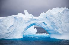 Iceburg in Antarctica with natural arch